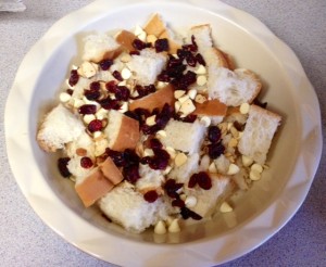 1/2 bread covered with cherries, chips, and almonds