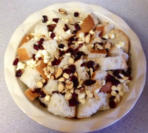 Bread covered with cherries, chips, and almonds