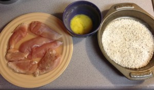 Raw chicken, egg, and breadcrumbs frying station